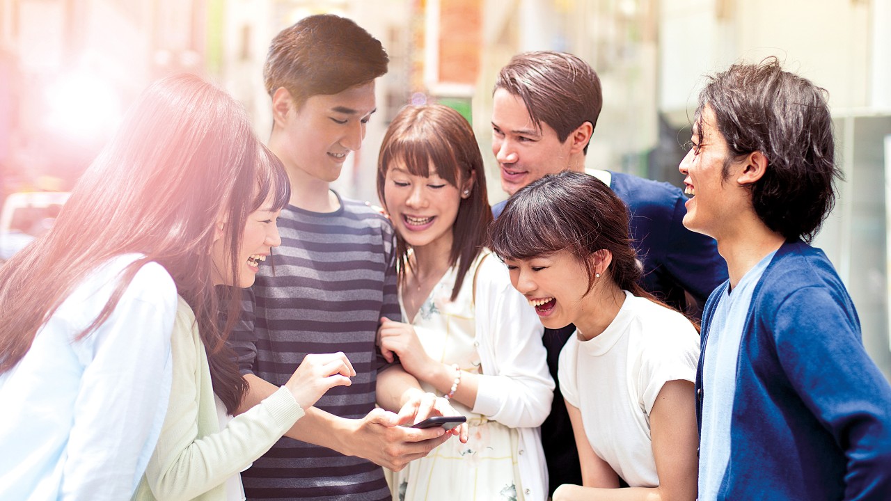 Group of young people with smart phone; image used for at your service 24/7.