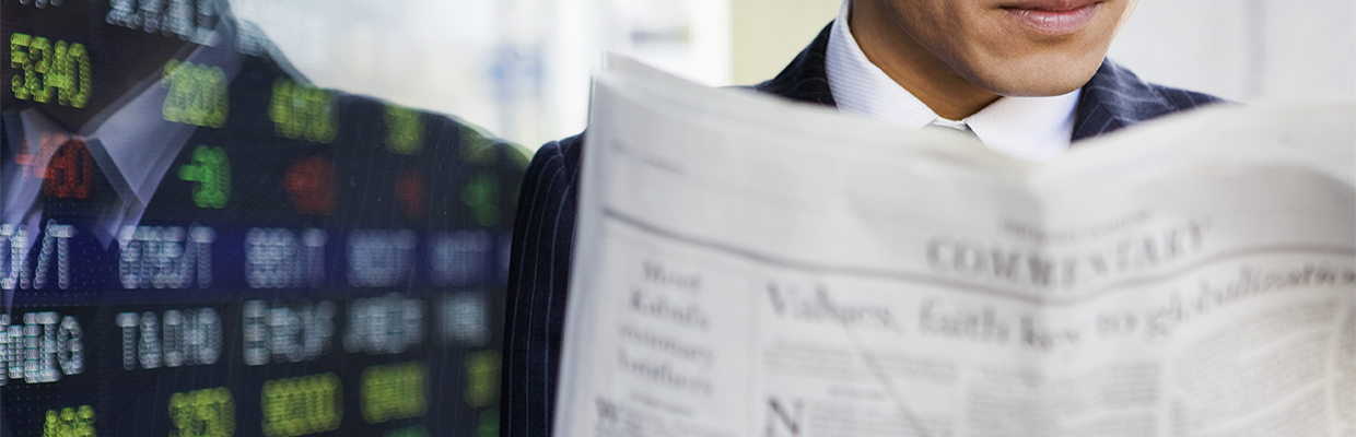 A man reading financial news; image used in market talk