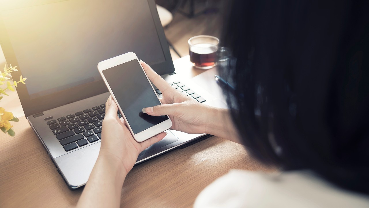 Businesswoman working online using mobile