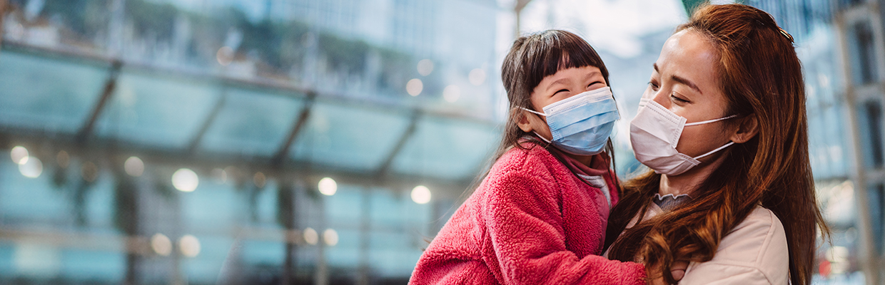 Mother and daughter wearing mask; image used for Coronavirus (COVID-19) guidance and support.
