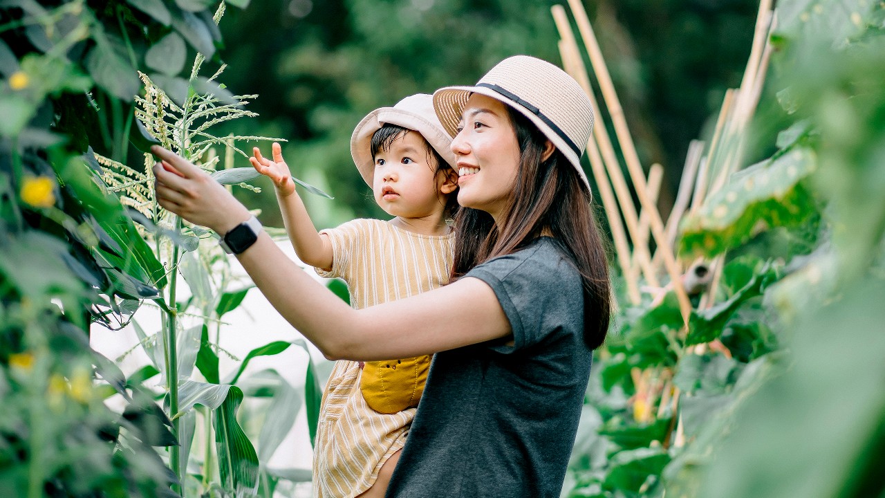 A mother and daughter in the garden; image used for About HSBC website.