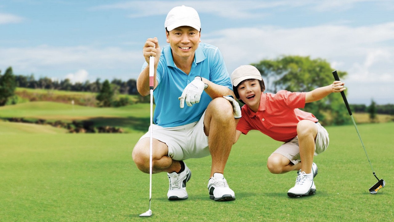 Father and son are playing golf; image used for HSBC Health Goal Insurance Plan.