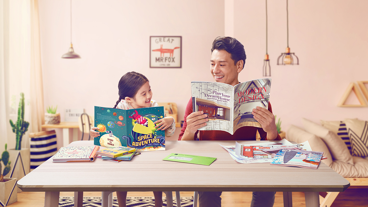 Father and daughter enjoy reading with Hong Kong tax letter on the table; image used for HSBC Personal Instalment Loan in 2019.