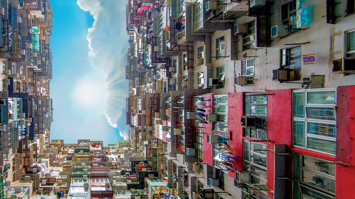 Looking up the sky surrounded by buildings; image used for No Fixed Address Service.