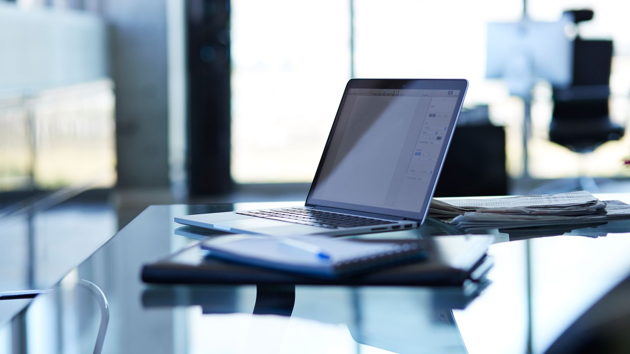 A laptop on the desk; image used for HSBC cyber security index.