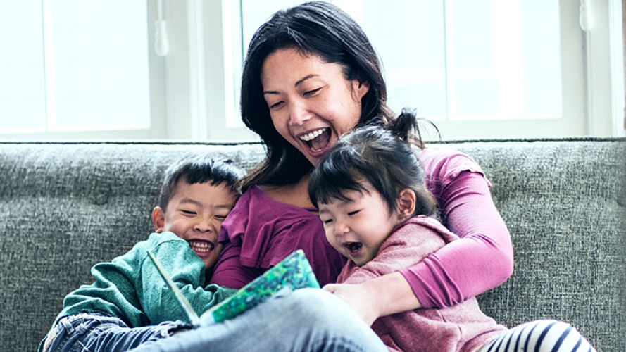 Mother reading to young son and daughter; image used for HSBC Term Life Protector Insurance