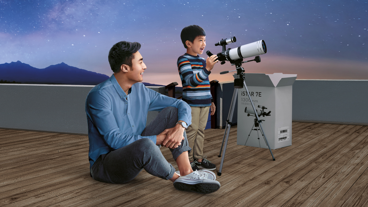 Father and son stargazing, image used for latest hsbc mpf offer.