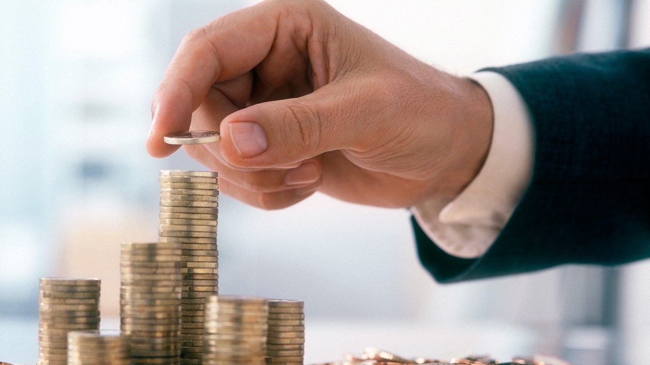 Staking up coins; image used for HSBC Wealth Portfolio Intelligence Service