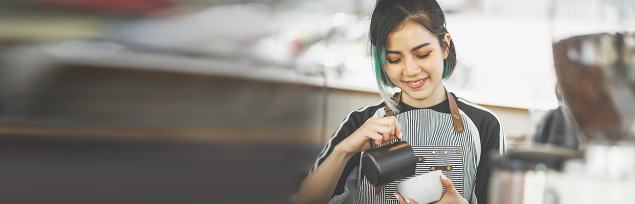 Barista working in a cafe; image used for Career Starter Hub page.