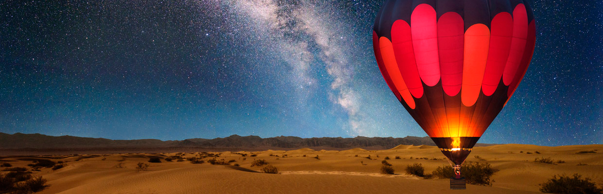 Hot air balloon over the desert;image used for Wealth products.