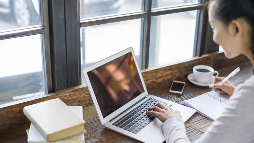 Woman is working with her laptop; image used for HSBC Ways to bank.