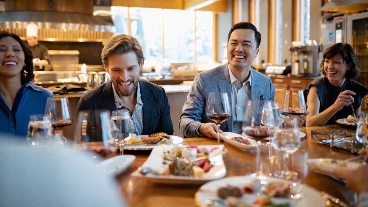 A group of friends are having a reunion lunch happily; image used for the HSBC Hong Kong WeChat page.